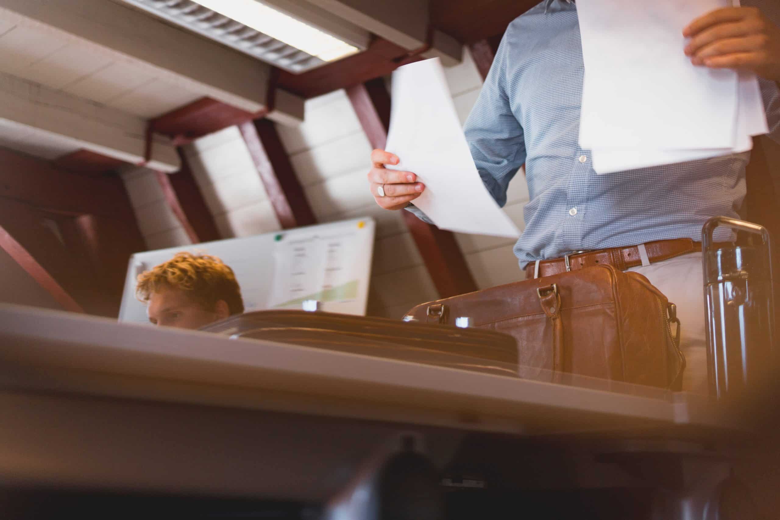 Man looking at papers in office