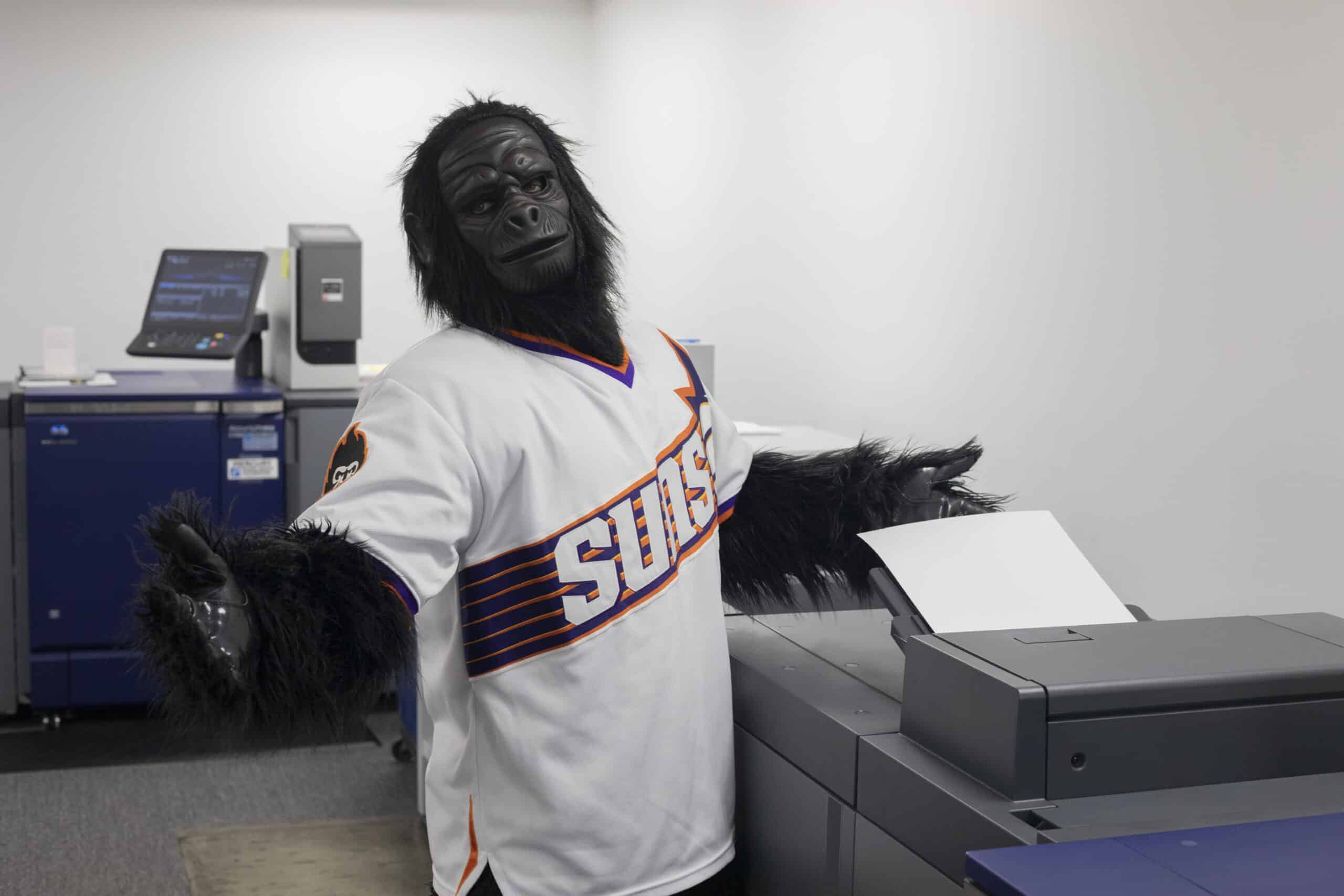 Gorilla mascot at a printer