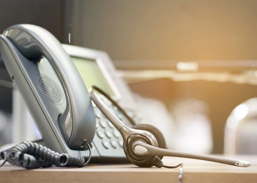Headset and phone on desk