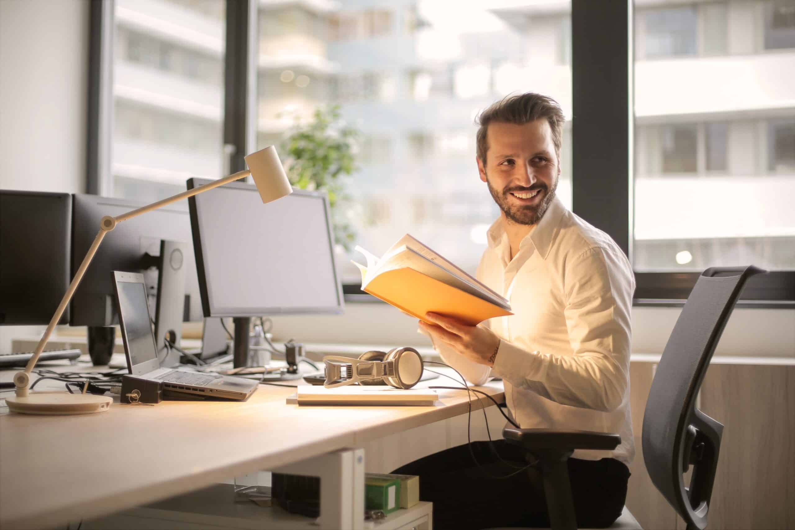 Man smiling at desk