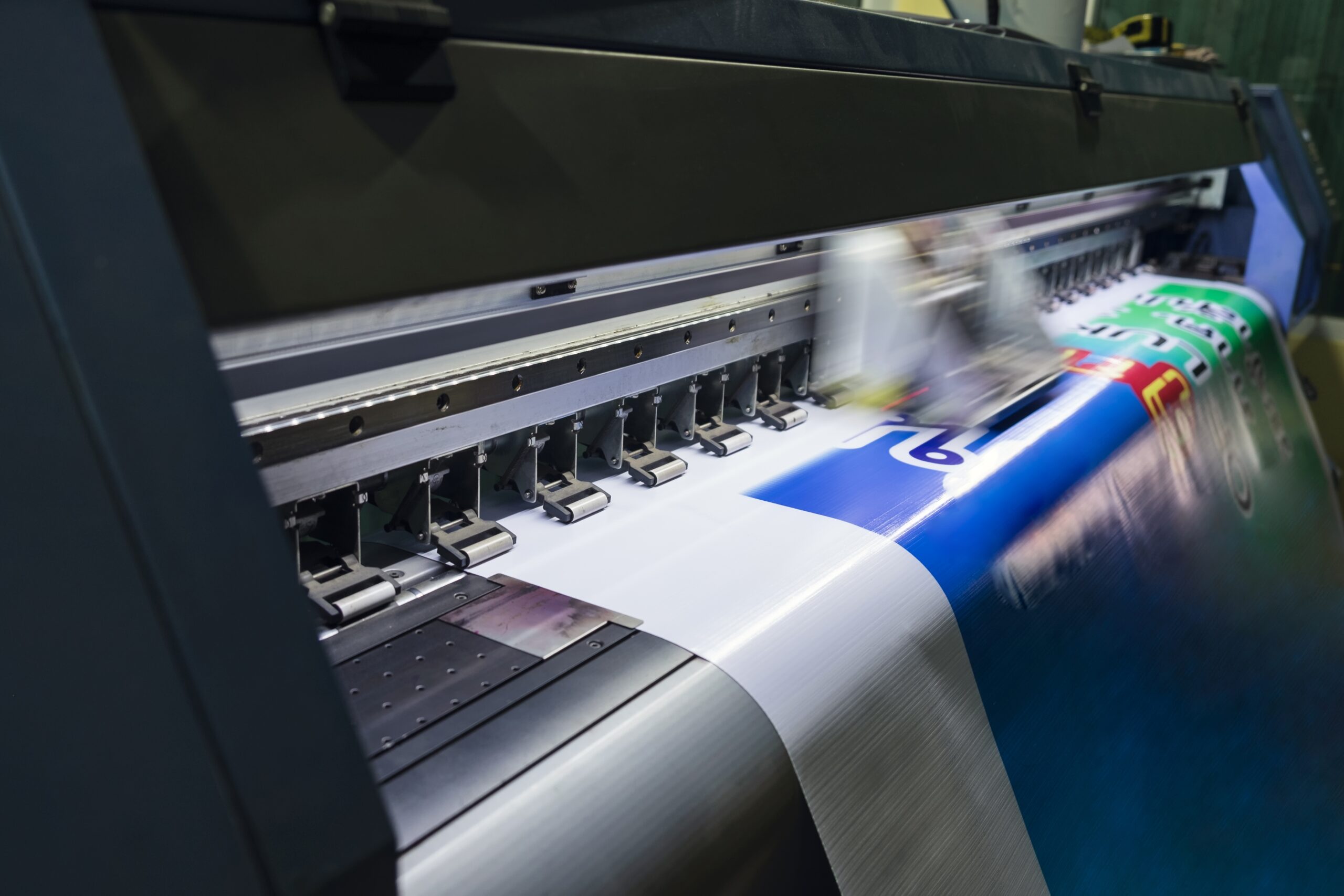 Large,Format,Inkjet,Printer,Machine,Working,On,Vinyl,Paper,In